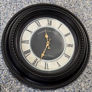 Classic Black and Gold Battery Operated Wall Clock. 21” X 21” X 2”.